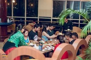 a group of people enjoying food at city centre nepal
